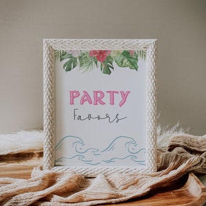 May include: White wooden frame with a white background and pink text that says "PARTY FAVORS". The frame is decorated with a tropical floral border and blue waves at the bottom.