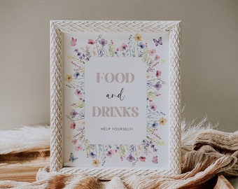 May include: A framed sign with the words "FOOD and DRINKS" in a soft, neutral font, surrounded by a floral border. The sign is in a white, textured frame and includes the phrase "HELP YOURSELF!" at the bottom. The sign is on a wooden tray.