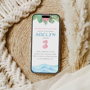 May include: A digital invitation for a 3rd birthday party with a beach theme. The invitation features a watercolor illustration of ocean waves and tropical leaves. The text reads "The ocean is calling you! Join us to celebrate Adelyn turning 3. Sun | June 22 | 2-4 PM 123 Dino Way, Anywhere 12345 RSVP to Emily at (555) 555-5555 or emailme@yahoo.com"