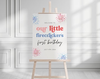 May include: Welcome to our little firecracker's first birthday sign with a white background and red, blue, and pink watercolor fireworks. The text is in a red, pink, and blue font. The date is July 4th, 2024.