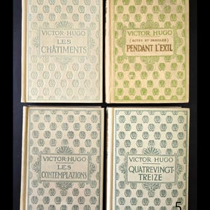 May include: Four vintage books by Victor Hugo are shown. The book covers have repeating patterns and titles in elegant fonts. The titles include "Les Ch&acirc;timents", "Pendant L'Exil", "Les Contemplations", and "Quatrevingt-Treize". The books are in shades of green and cream.
