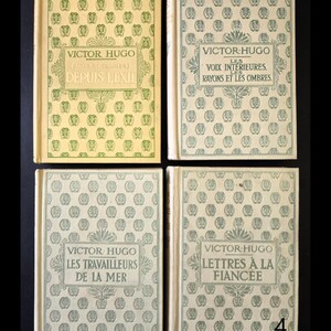May include: Four antique books by Victor Hugo, with French titles and decorative covers. Titles include "Depuis L'Exil", "Les Voix Int&eacute;rieures", "Les Travailleurs de la Mer", and "Lettres &agrave; la Fianc&eacute;e". The covers have a repeating pattern.