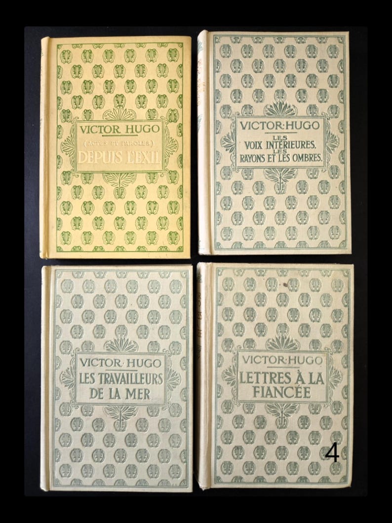 May include: Four antique books by Victor Hugo, with French titles and decorative covers. Titles include "Depuis L'Exil", "Les Voix Int&eacute;rieures", "Les Travailleurs de la Mer", and "Lettres &agrave; la Fianc&eacute;e". The covers have a repeating pattern.