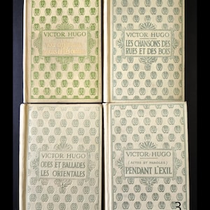 May include: Four vintage books by Victor Hugo. The covers feature repeating patterns and titles in French. The books are in shades of green and cream, with titles including "Voix Giterieures", "Les Chansons des Rues", "Odes et Ballades", and "Pendant L'Exil".