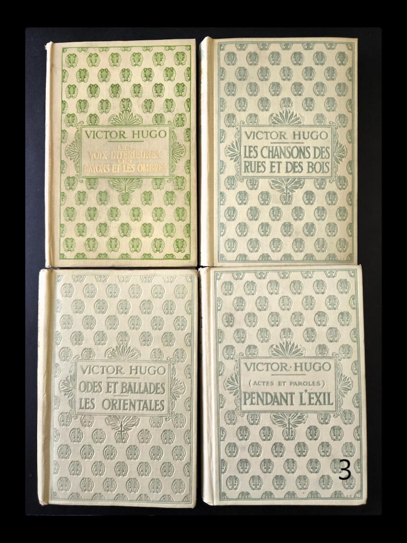 May include: Four vintage books by Victor Hugo. The covers feature repeating patterns and titles in French. The books are in shades of green and cream, with titles including "Voix Giterieures", "Les Chansons des Rues", "Odes et Ballades", and "Pendant L'Exil".