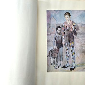 May include: A book page featuring a reproduction of a painting showing two figures and a dog. One figure wears a colorful diamond-patterned harlequin costume, while the other wears a dark grey outfit. The background is a muted landscape.