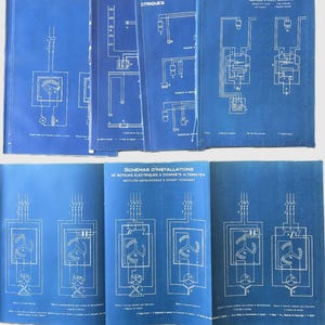 May include: A collection of vintage blue books with white technical diagrams. The books feature schematics of electrical circuits, motors, and telephone systems. The text on the covers includes "CTRIQUE" and "TELEPHONES".