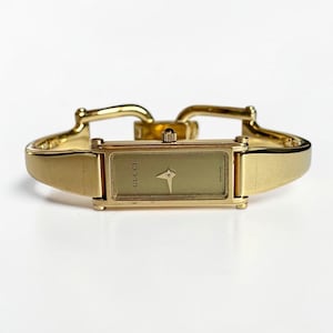 Vintage Gucci Armreif-Uhr – Vergoldete rechteckige Damenuhr