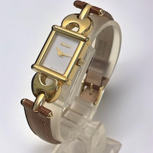 Rechthoekig vintage Gucci-dameshorloge | Vergulde, nieuwe bruine Gucci-leren band
