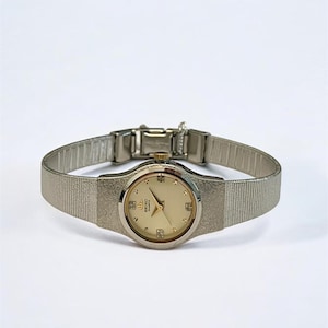 Vintage Seiko Women&#39;s Watch – Silver Tone Case, Champagne Gold Dial with Diamond Hour Markers