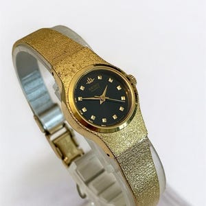 Vintage Seiko Women&#39;s Watch: Gold Tone & Black Dial, Japanese Quartz