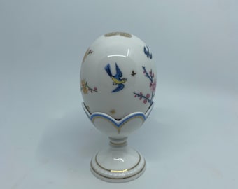 Minton bone china egg and stand in “The Emperor’s Garden” pattern.  Limited edition of 3500 world wide.  This egg is number 299 of 3500.