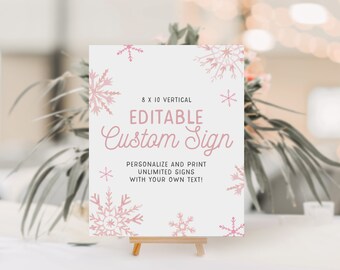 May include: An 8x10 inch vertical printable sign with a pink snowflake design. The sign says "Editable Custom Sign" and "Personalize and print unlimited signs with your own text!"