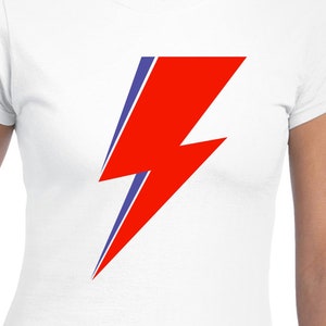 May include: White t-shirt with a red and blue lightning bolt graphic.