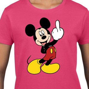May include: A pink t-shirt featuring a cartoon image of Mickey Mouse giving the middle finger.