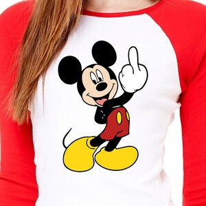 May include: A white and red baseball tee shirt with a cartoon image of Mickey Mouse giving the middle finger.