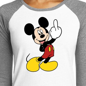 May include: A cartoon image of Mickey Mouse giving the middle finger. Mickey is wearing his signature red shorts with yellow buttons and black shoes. He is smiling.