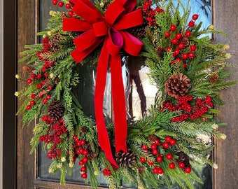 Norfolk pine and cedar classic Christmas wreath with red velvet bow gold bells, Christmas greenery and red berry wreath for your front door