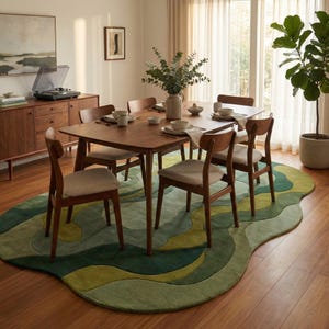May include: A dining room set with a wooden table and six chairs. The table is set with plates and napkins. A green and yellow patterned rug is under the table. A wooden cabinet and a record player are in the background.