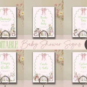 May include: Six printable baby shower signs with a green and pink floral design. The signs feature text such as "Favors", "Books for Baby", "Mimosa Bar", "Diaper Raffle", "Cards & Gifts", and "Custom Sign".