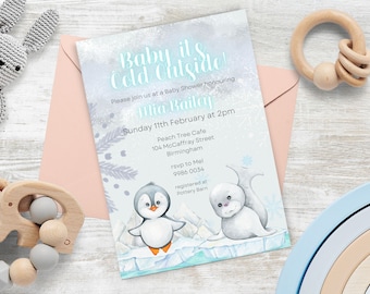 May include: A blue and white baby shower invitation with a penguin and a seal on an ice floe. The invitation reads "Baby it's Cold Outside!" and includes the details of the shower, including the date, time, location, and RSVP information.