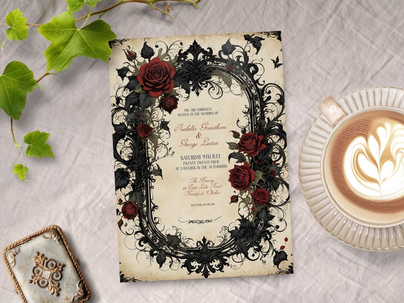 May include: A gothic wedding invitation with a black and white ornate frame with red roses. The text reads "You are cordially invited to the wedding of Isabella Grantham & George Linton Saturday 9th July Twenty Twenty Four at 3 o'clock in the afternoon The Ceremony at Great Lake Road Mansfield, Ontario Reception to follow"