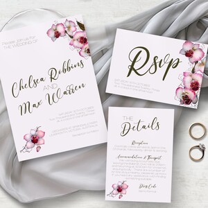 May include: Wedding invitation with pink orchid floral design. The invitation reads "Please join us for the wedding of Chelsea Robbins and Max Warren" and includes the date, time, and location of the ceremony. The RSVP card reads "RSVP" and includes the date, time, and location of the reception. The details card includes information about the reception, accommodation, and transportation. The dress code is semi-formal.