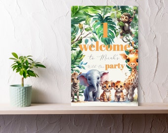 May include: A welcome sign for a first birthday party with a jungle theme. The sign features a giraffe, elephant, zebra, and two lion cubs. The text on the sign reads "Welcome to Micah's Wild One Party".