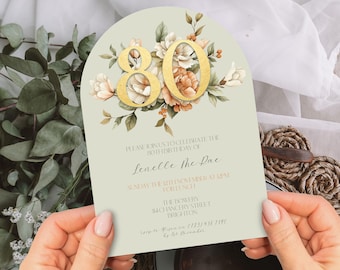 May include: A green and white floral themed invitation for an 80th birthday party for Lenelle the Pac. The invitation includes the date, time, and location of the party.