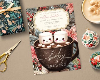 May include: A baby shower invitation with a hot chocolate theme. The invitation features a mug of hot chocolate with two marshmallows, the text "baby is brewing", and event details. Ornaments and a wrapped gift are also visible.