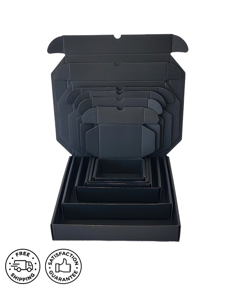 May include: A set of nested black corrugated cardboard boxes, each with a square base and a lid. The boxes are arranged to show the different sizes, with the largest box at the bottom and the smallest at the top. The boxes are all black.