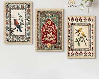 May include: Three rectangular wall art prints in light wood frames. The left print shows a blue bird on a branch, the center features a red and teal floral motif, and the right displays two yellow birds on a branch, all with ornate borders.
