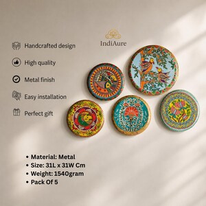 May include: A set of five circular metal wall art pieces featuring vibrant, hand-painted designs of birds, flowers, and geometric patterns. Each piece measures 31L x 31W cm. The collection includes various color palettes such as blue, yellow, red, and green, showcasing intricate details and artistic motifs on a metallic surface.