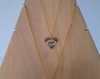 Collier double rang en chaîne dorée. Breloques cœur et oeil de protection,  cercle martelé