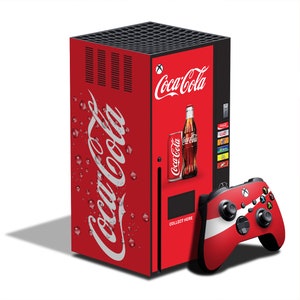 May include: A red Coca-Cola themed Xbox Series X console with a matching controller. The console features the Coca-Cola logo and a vending machine design. The controller is red with white stripes and Xbox buttons.