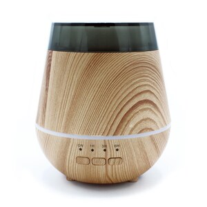 May include: A tapered essential oil diffuser with a light brown wood grain finish and a dark translucent top section. The front features three control buttons labelled ON, 1H, 3H, and 6H, with small indicator lights positioned above each button.