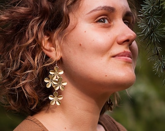 Brass metalwork sakura flower earrings. Bold matte gold aesthetic floral earrings. Unique long botanical earring. Romantic fairycore jewelry
