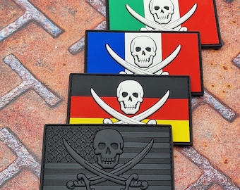 May include: Four embroidered patches featuring a skull and crossbones design on different national flags. The flags are Italian, French, German, and American. The patches are black with white stitching.