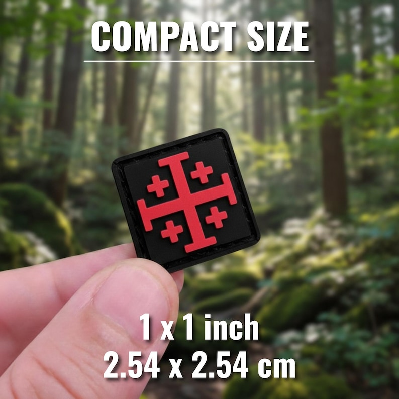May include: A black square patch with a red Jerusalem cross design. The patch is 1 x 1 inch in size, with the text "COMPACT SIZE" above and "1 x 1 inch 2.54 x 2.54 cm" below. The background is a blurred forest scene.