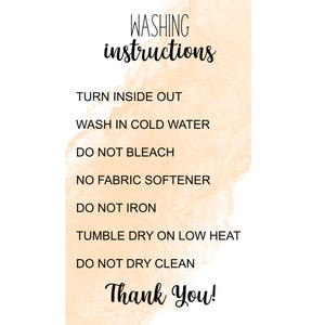 May include: A peach-colored watercolor background with black text outlining washing instructions: Turn inside out, Wash in cold water, Do not bleach, No fabric softener, Do not iron, Tumble dry on low heat, Do not dry clean. The text "Thank You!" is at the bottom of the image.
