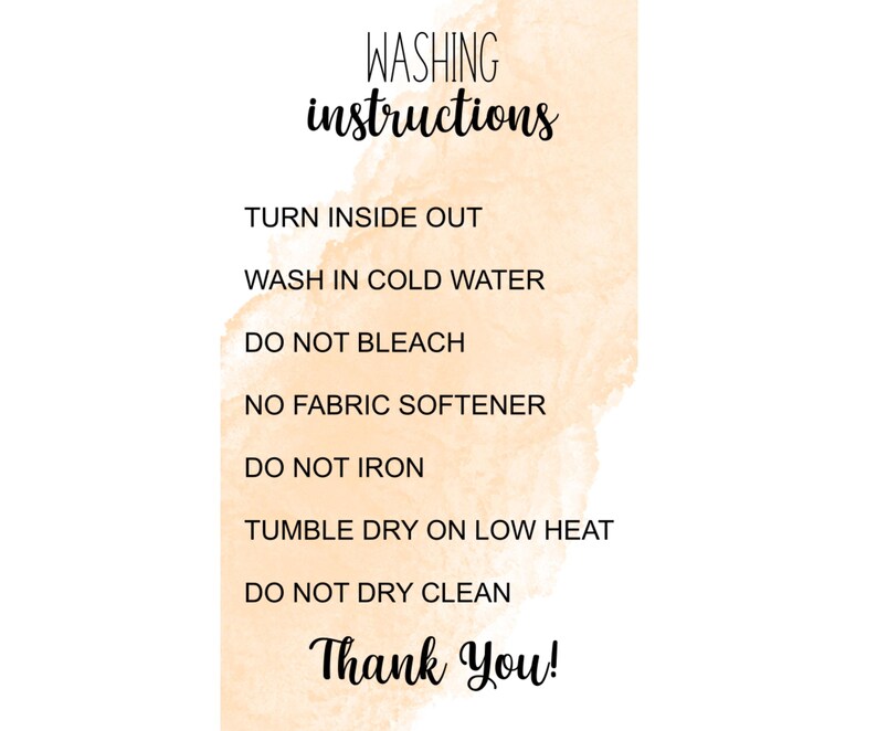 May include: White background with a watercolor-style peach-colored wash. Black text reads "WASHING instructions" followed by care instructions: turn inside out, wash in cold water, do not bleach, no fabric softener, do not iron, tumble dry on low heat, do not dry clean, and "Thank You!"