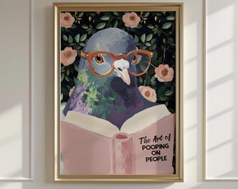 May include: Framed art print featuring a pigeon wearing orange glasses, reading a book with the text "The Art of Pooping on People." The background has a floral pattern with pink roses and green leaves. The frame is gold.
