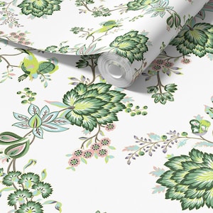 May include: White wallpaper roll featuring a repeating floral pattern. The design includes large green leaves, smaller pink flowers, and light blue accents. The pattern is a botanical design with a vintage aesthetic.