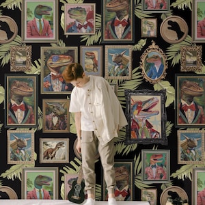 May include: A black background wallpaper with a repeating pattern of framed images of dinosaurs wearing suits and bow ties. The dinosaurs are in various poses and expressions. The frames are gold and black with a tropical leaf pattern.