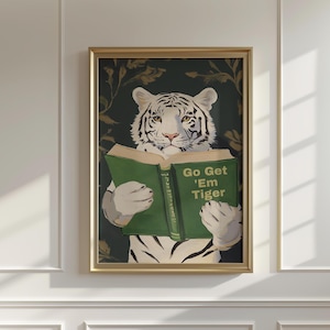 May include: Framed art print featuring a white tiger reading a green book. The book's cover reads "Go Get 'Em Tiger". The tiger is set against a dark green background with floral accents, all within a gold frame.