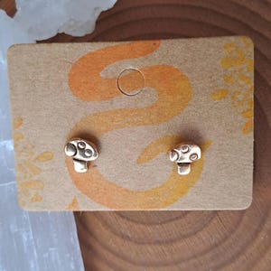 Tiny gold mushroom studs, cute small dainty earrings, solid bronze studs, handcrafted earrings, cottagecore, fairycore, stainless steel pins