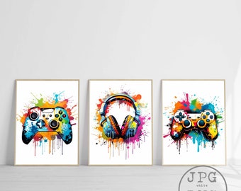 May include: Three colorful digital art prints featuring a video game controller, headphones, and a second video game controller. Each image has a white background with colorful paint splatters.