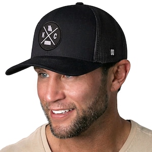 May include: Black trucker hat with a black and white embroidered patch featuring the state of Missouri and the letters "K.C." in a circle.