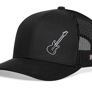 May include: Black trucker hat with a white outline of an electric guitar on the front. The hat has a mesh back.