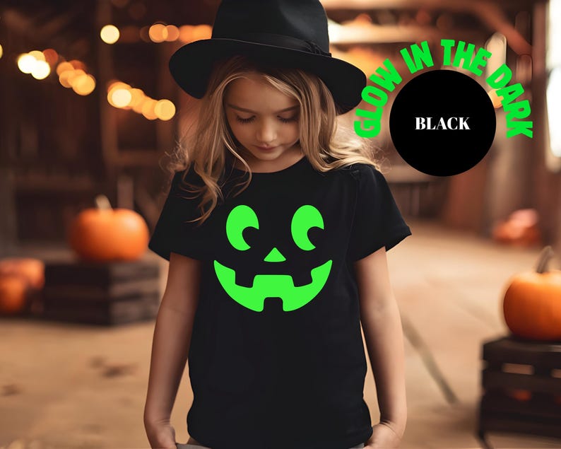 glow pumpkin shirt, halloween matching, jack o lantern face, spooky family shirt, glow in dark tee, halloween tee set, family costume tee, matching pumpkin top, dark grey tee set, halloween graphic, trick or treat outfit, pumpkin glow shirt, halloween night top